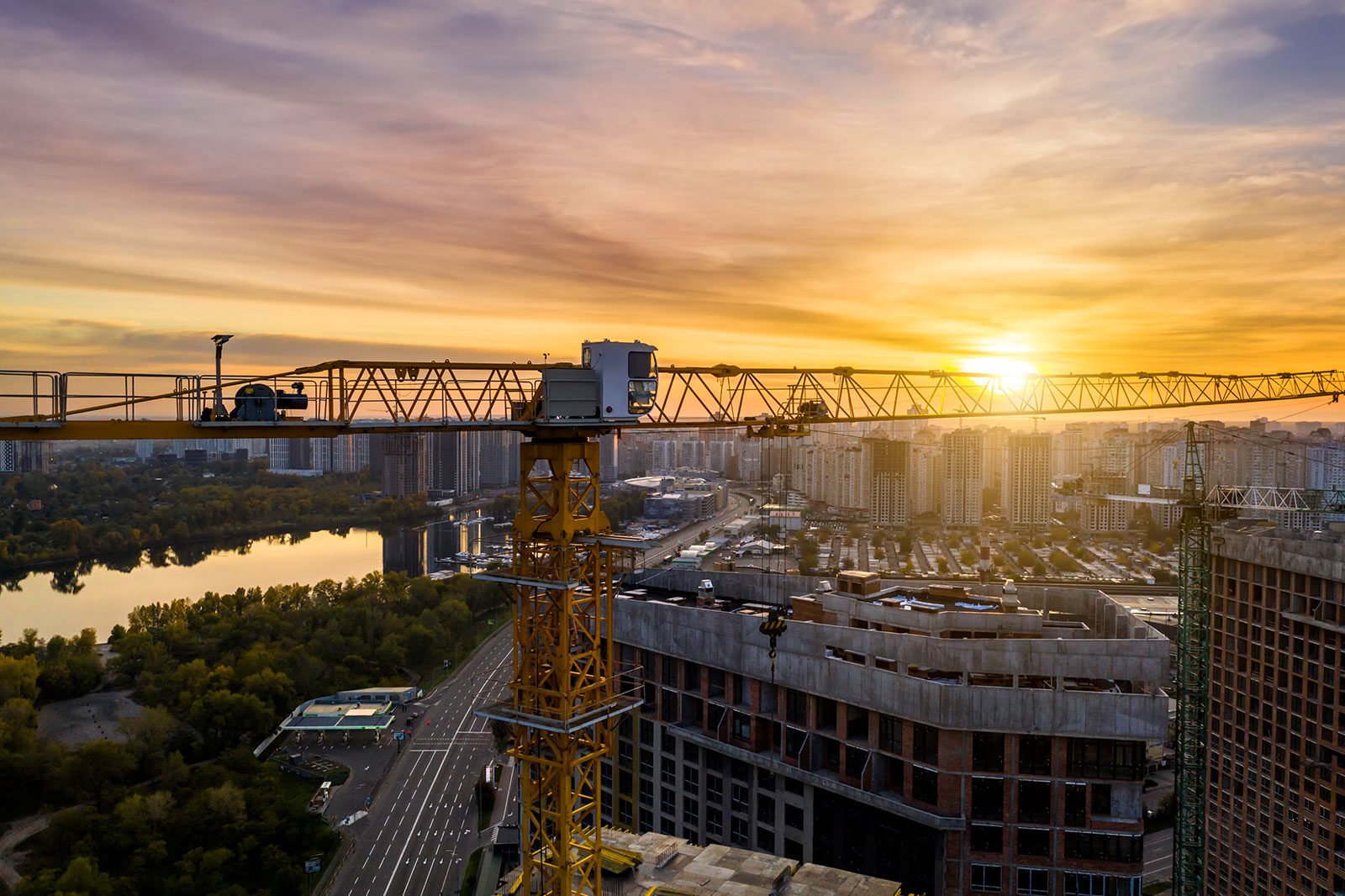 Construction site with cranes at sunset(News)